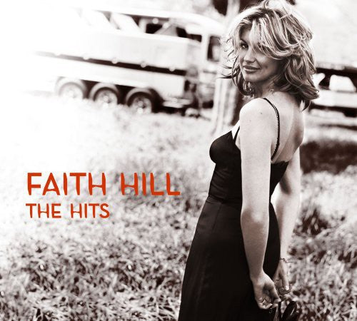 the album cover for Faith Hill - The Hits