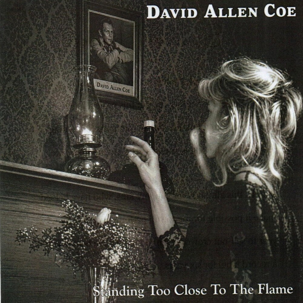 the album cover for David Allan Coe - Standing Too Close To the Flame