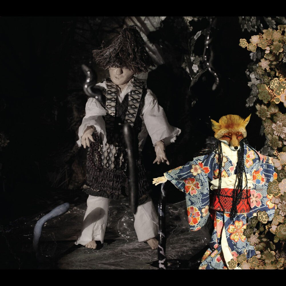the album cover for Ikue Mori - Enchanted & Delighted