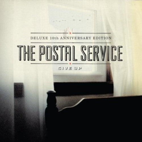 the album cover for The Postal Service - Give Up
