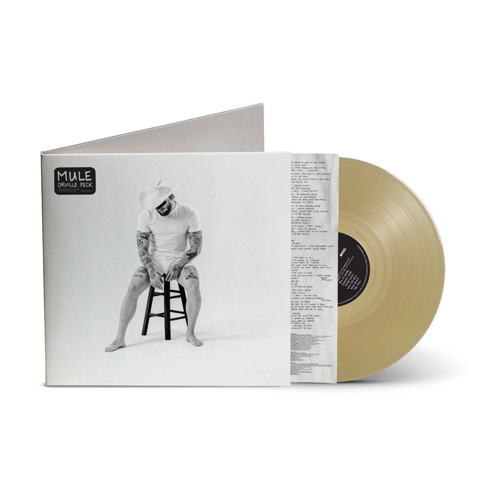 the album cover for Orville Peck - Mule [Indie Exclusive Tan Translucent]