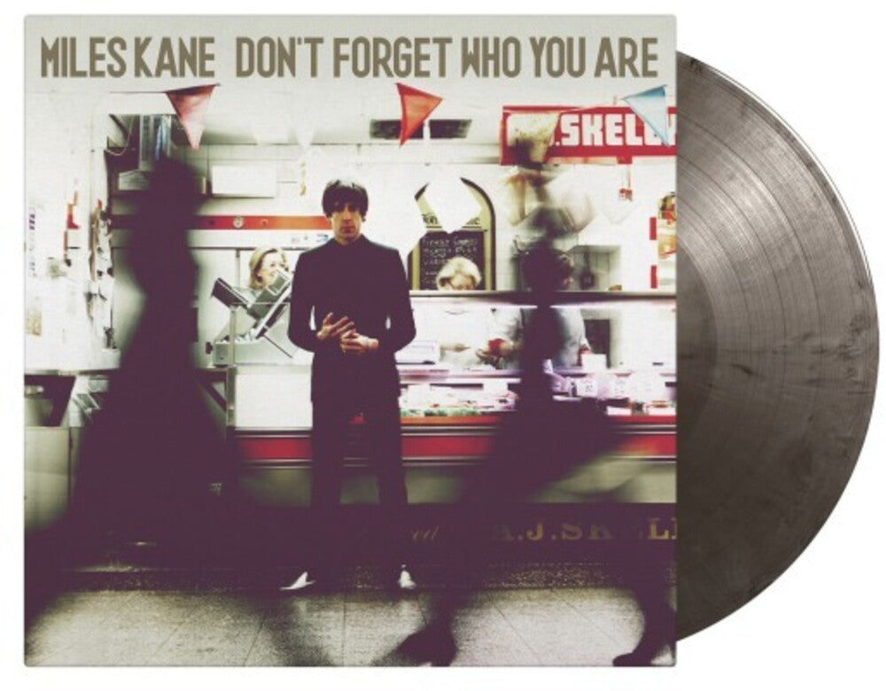 the album cover for Miles Kane - Don't Forget Who You Are [Import Limited Edition Silver & Black Marble LP]