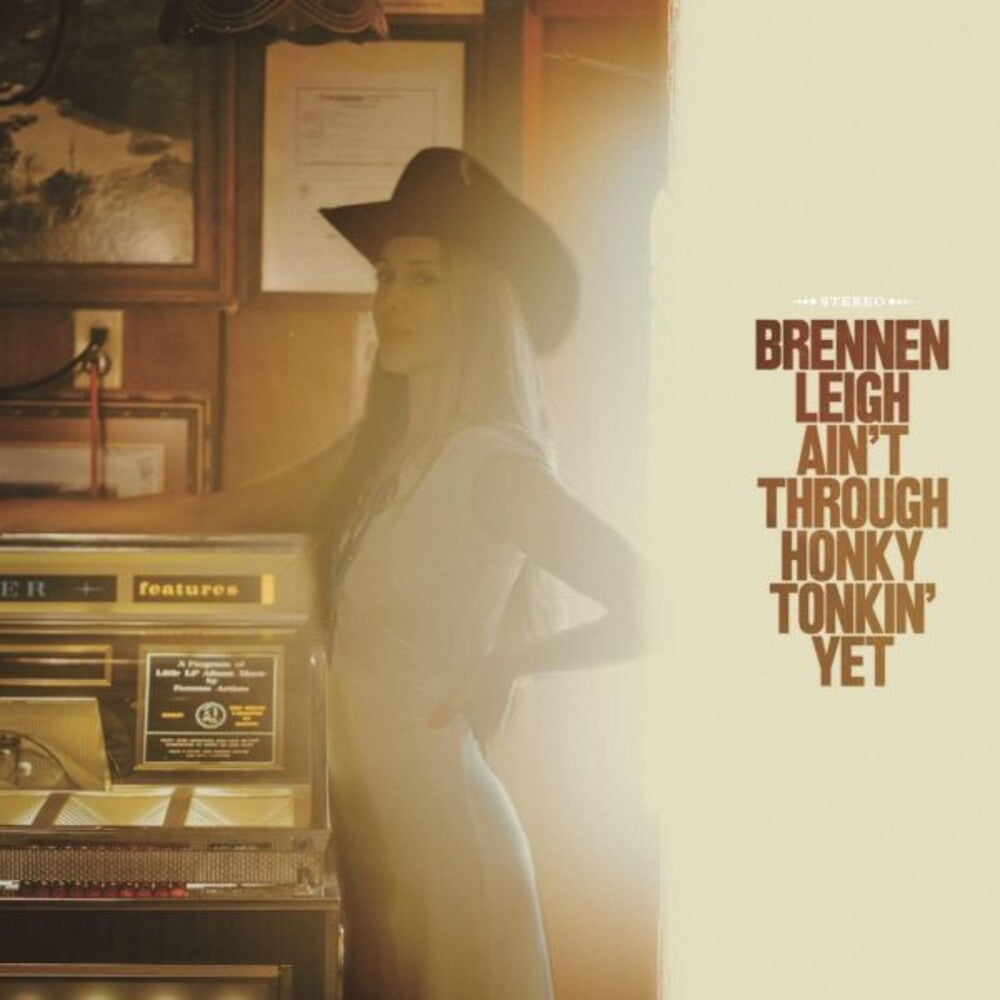the album cover for Brennen Leigh - Ain't Through Honky Tonkin' Yet