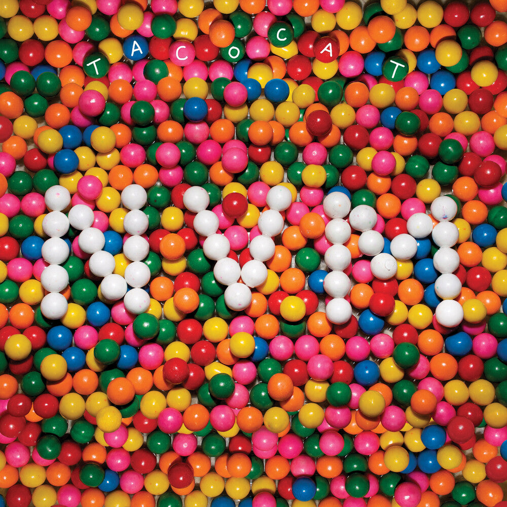 the album cover for Tacocat - Nvm - Gold [Colored Vinyl] (Gol) [Limited Edition] (Aniv) [Reissue]