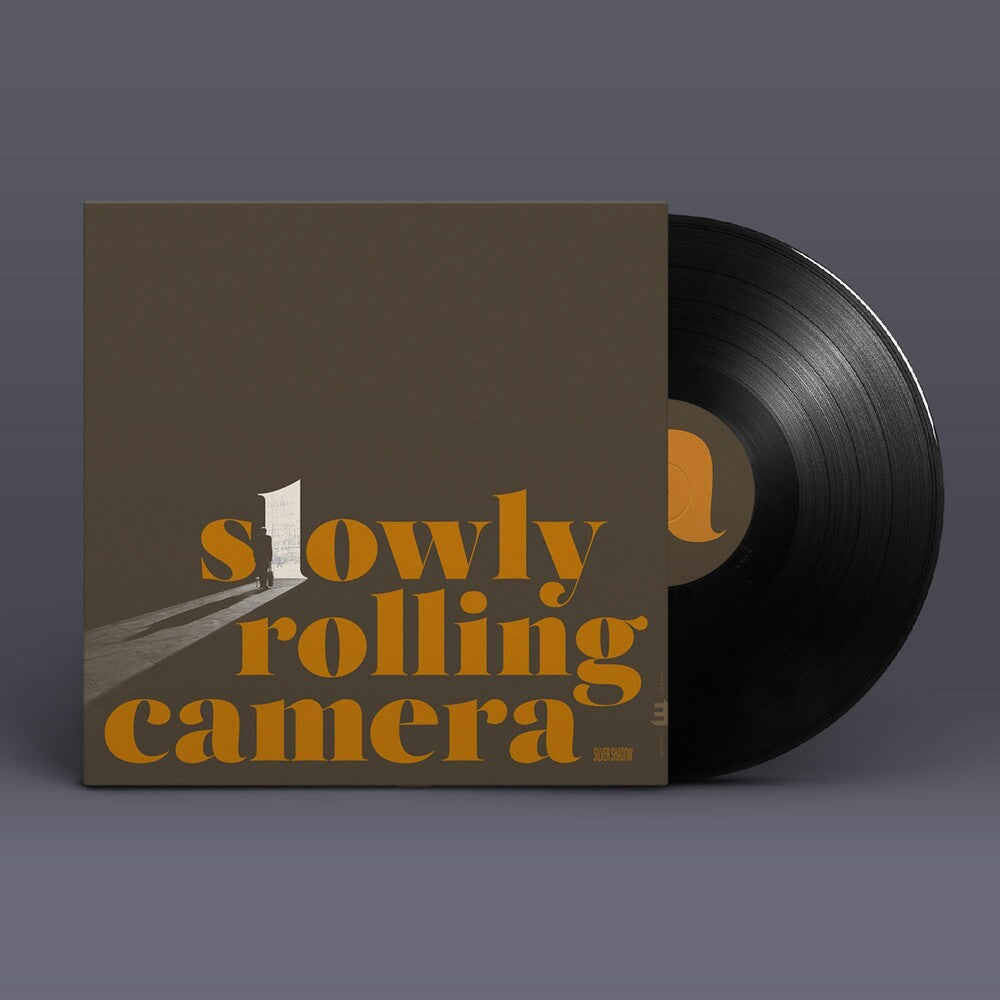 the album cover for Slowly Rolling Camera - Silver Shadow