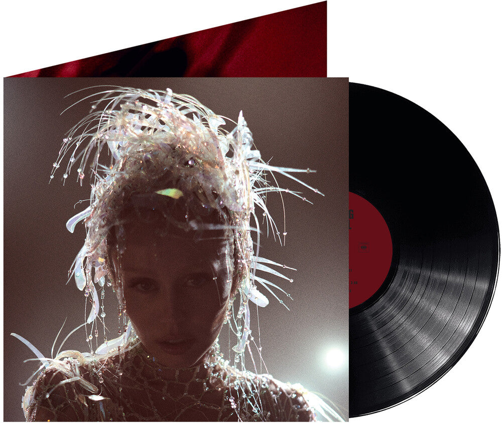the album cover for Miley Cyrus - Something Beautiful
