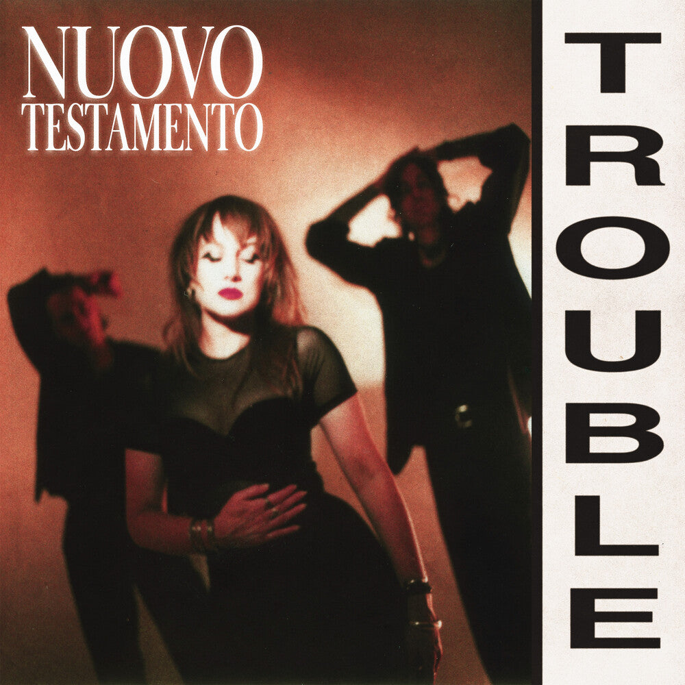 the album cover for Nuovo Testamento - Trouble  [Aqua Blue + Light Yellow + Magenta LP]