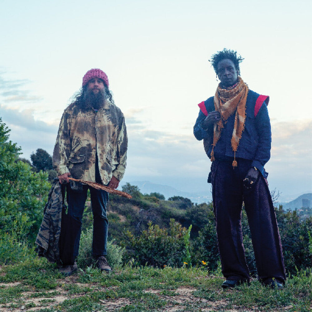 the album cover for Saul Williams  / Nino,Carlos - Saul Williams Meets Carlos Nino & Friends At [With Booklet]