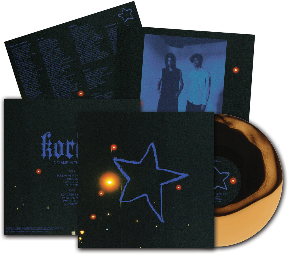 the album cover for Korine - A Flame In The Dark [LP Gold Black Swirl]