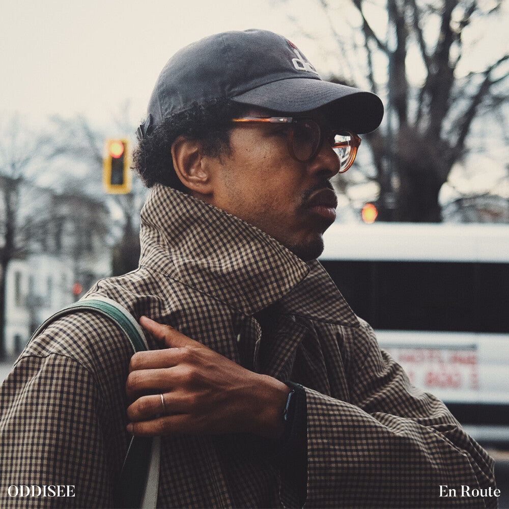 the album cover for Oddisee - En Route - Copper Black Ice (Blk) [Colored Vinyl] (Copp)