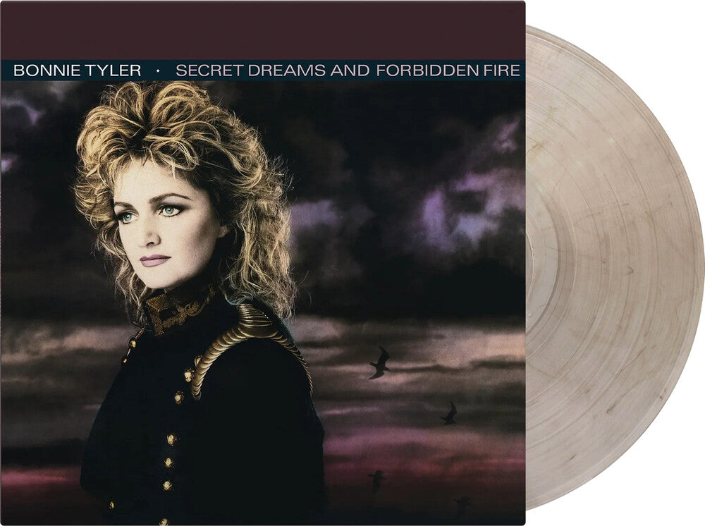 the album cover for Tyler, Bonnie - Secret Dreams & Forbidden Fire - Limited 180-Gram Crystal Clear & Black Marble Colored Vinyl
