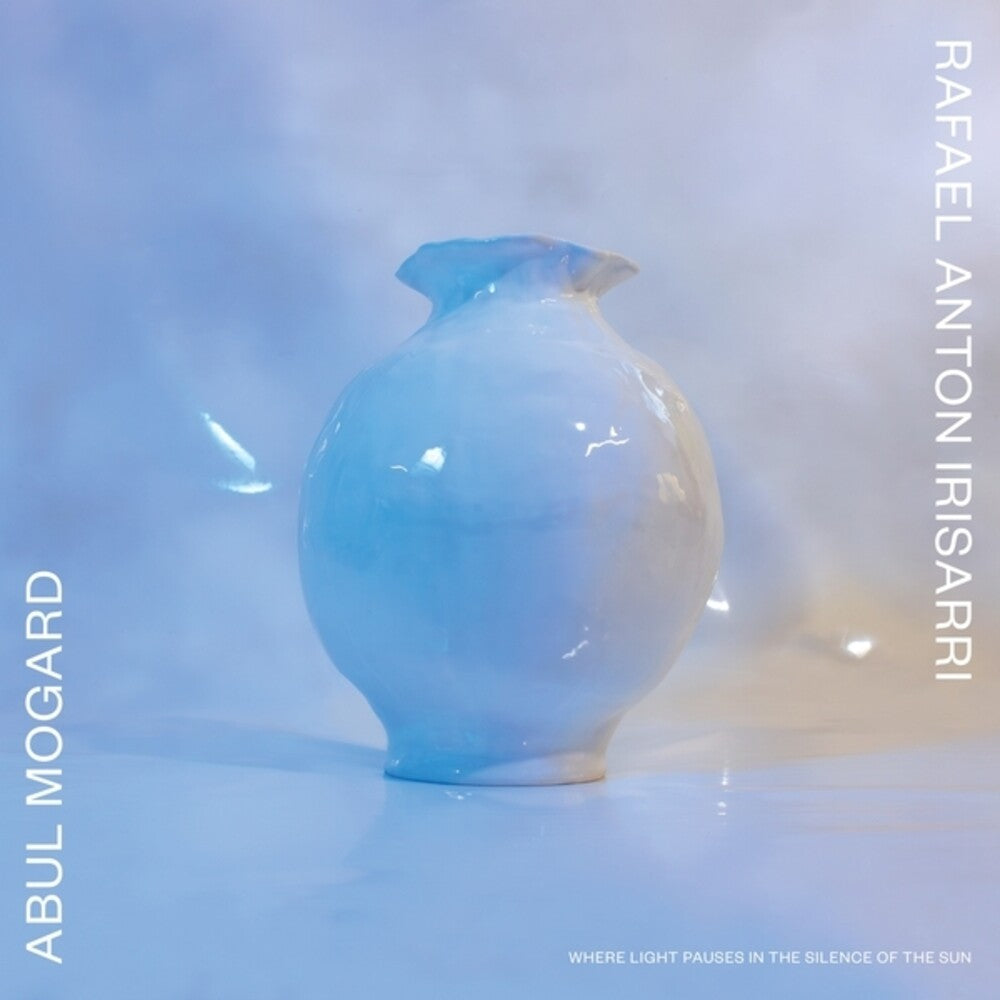 the album cover for Abul Mogard  / Rafael Anton Irisarri - Where Light Pauses In The Silence Of The Sun (Wht)