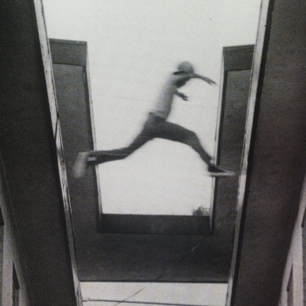 the album cover for Mos Def - The Ecstatic [Ruby Red Translucent]