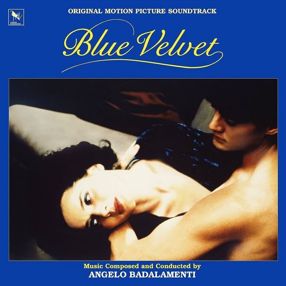 the album cover for Angelo Badalamenti - Blue Velvet Original Motion Picture Soundtrack - 40th Anniversary [Black + collectible rainbow foil jacket]
